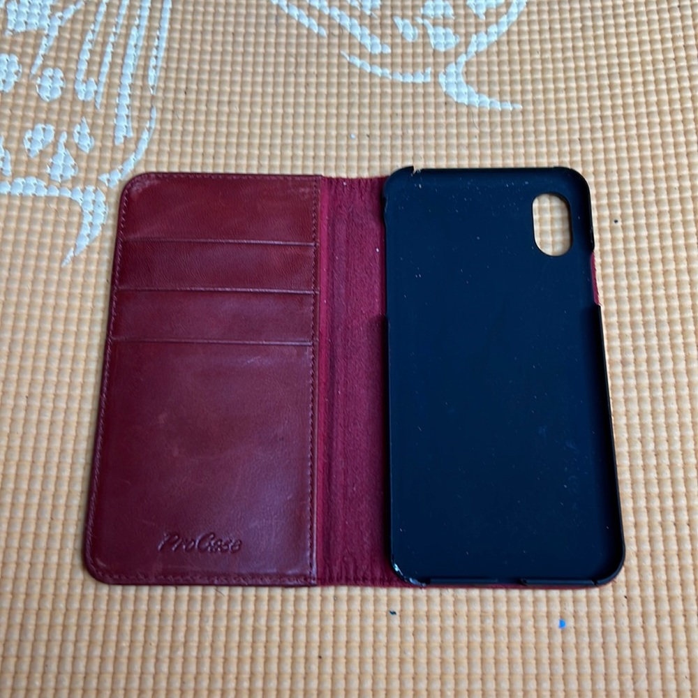 ProCase in a deep blood leather red IPhone XS case. It has sections for CC.